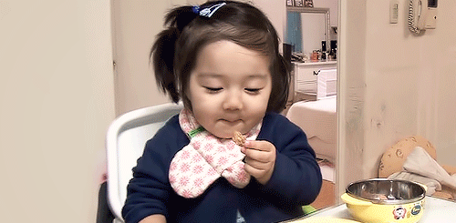 little asian girl eating